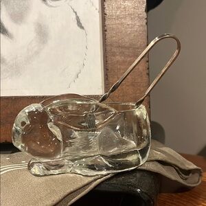 Glass bunny spoon rest.  Sugar tongs not included.
